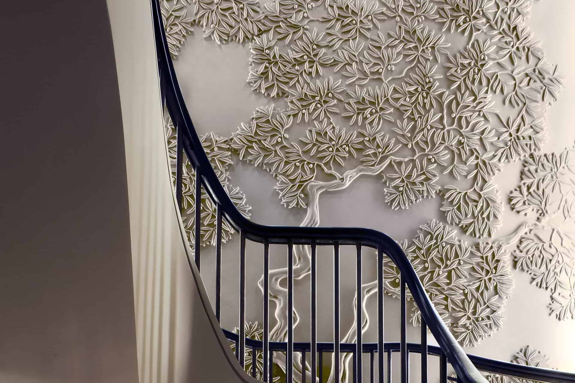 Olive tree design bas-relief, staircase, private apartment, London. Photo by James Silverman.